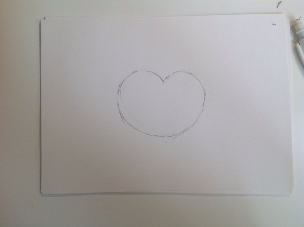 First of all you sketch the face. It should look like a heart but without a tip.