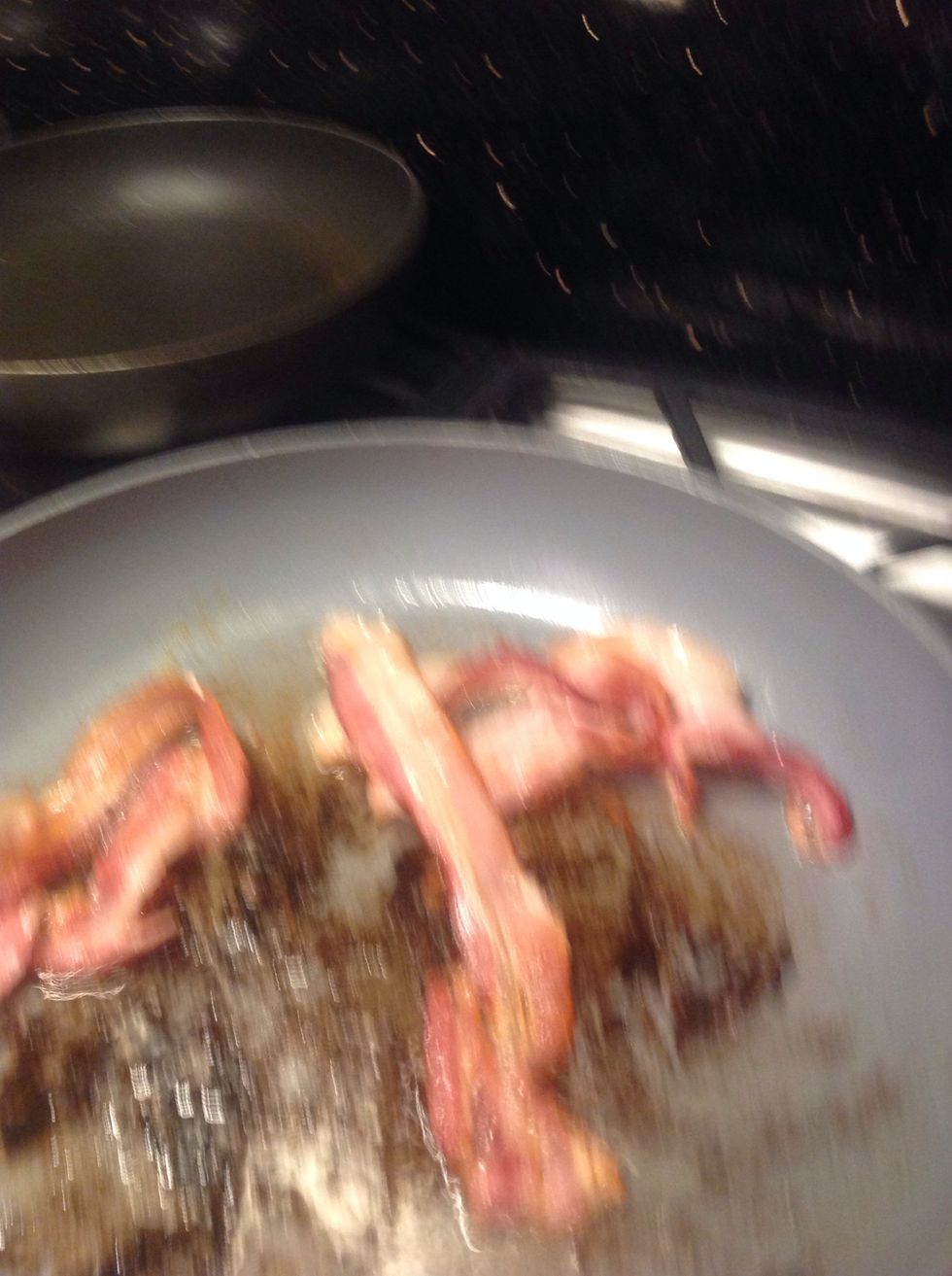 First off, fry the bacon. Cut in half when done.