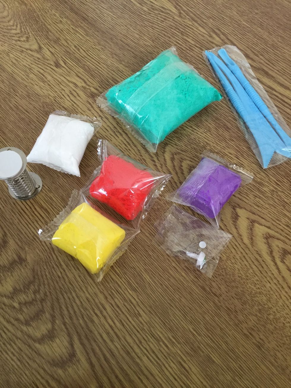 First off gather all your supplies . You will need; tools,spring,light clay (different colours) and goggles eyes