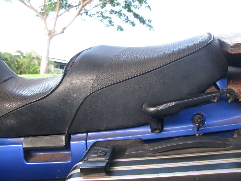 First off you have to remove the tank. To do so take off the seat to get to the two bolts that hold the tank on