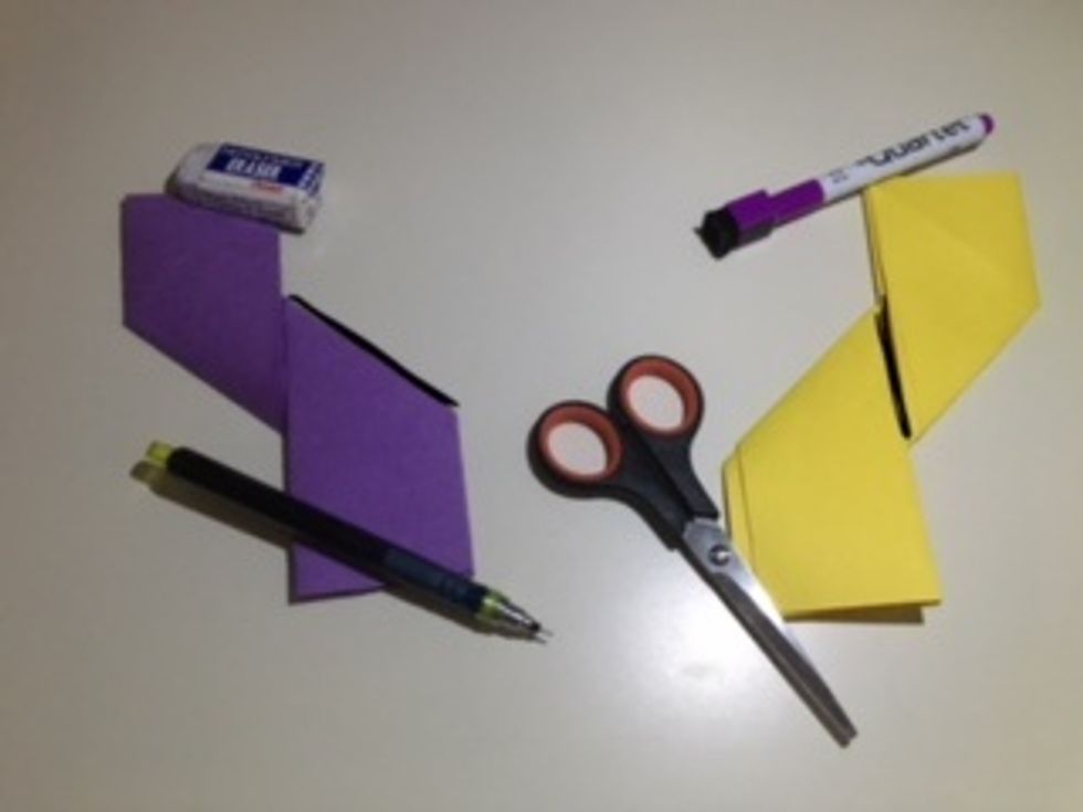 First paper: Fold the other side down so it partially aligns with the upward trapezoid at the vertical crease. Second paper: Do the same as the first, except fold the other side up. See mirror images.