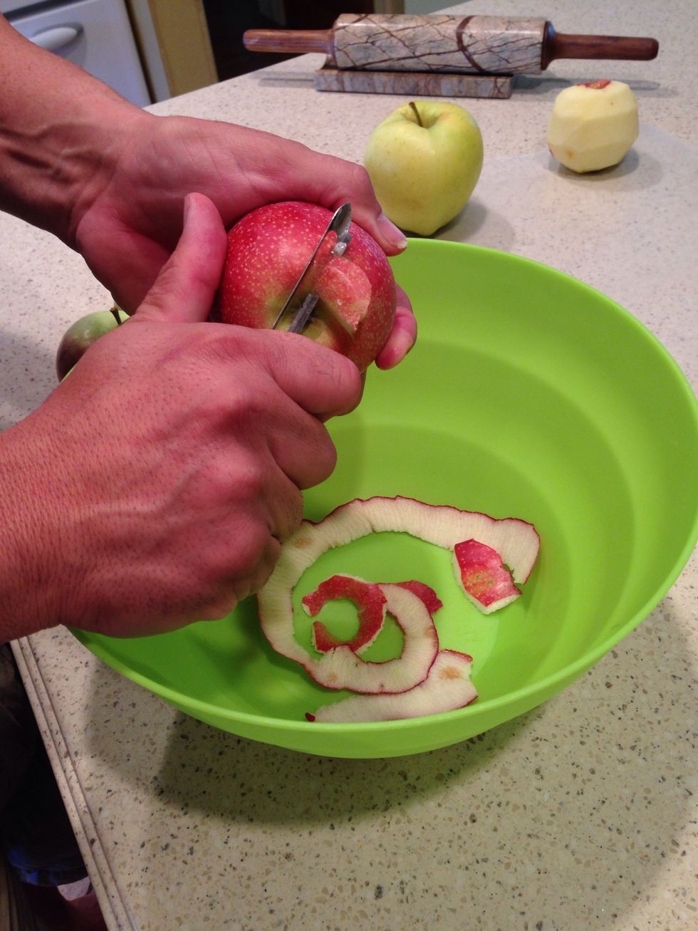 First, peel all 8 apples. We use a mix of sweet and tart apples