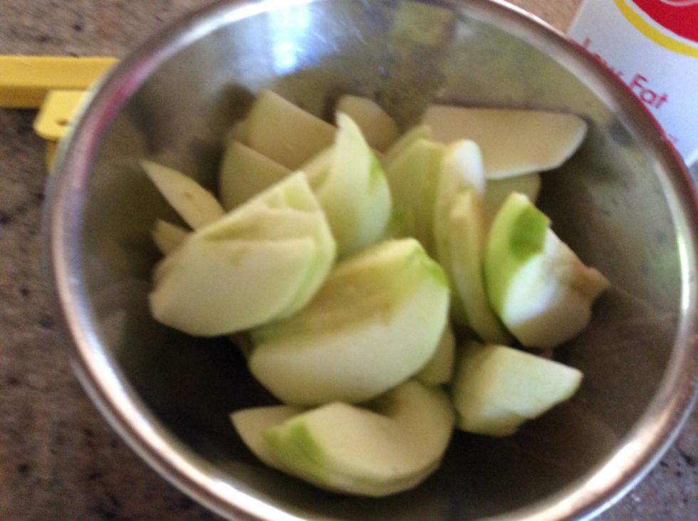 First peel and slice apples.