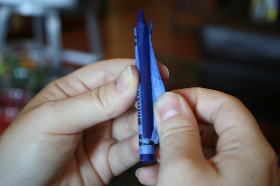 First peel the crayons. The easiest way to do this is to cut a vertical line though the paper with a knife but be careful not to cut the crayon.