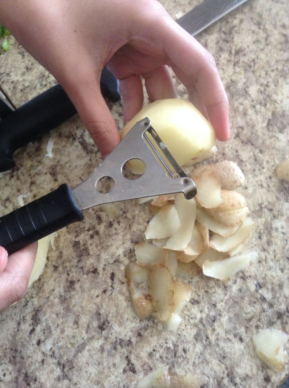 First, peel the potatoes.