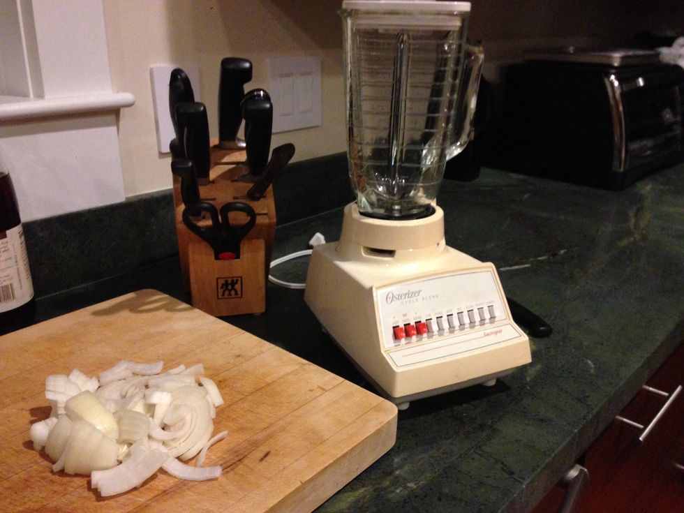 First, peel your onion and chop it up small enough to put in your blender. Now put it in the blender.