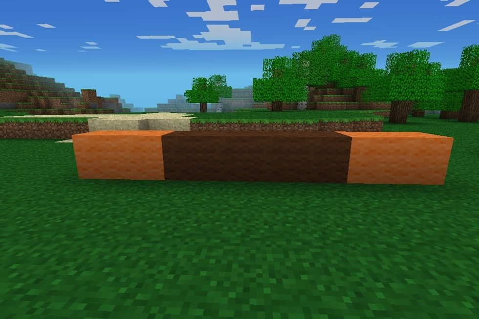 First place 4 brown wool in a row then put 2 orange wool either side