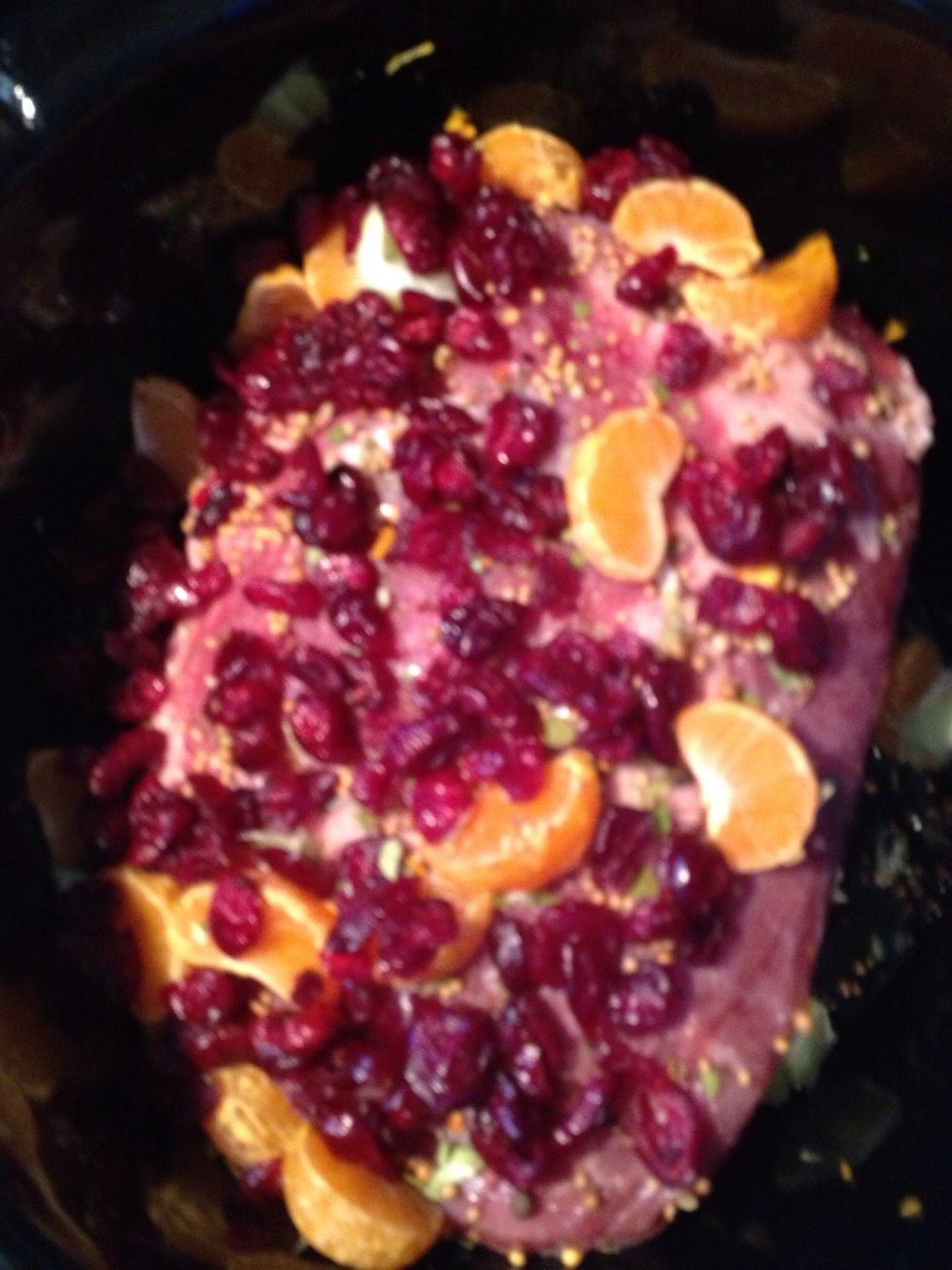 First place corned beef and sprinkle seasoned pack. Then peel and section tangerine and key lime. Place in crockpot on roast. Add craisins on top of that.