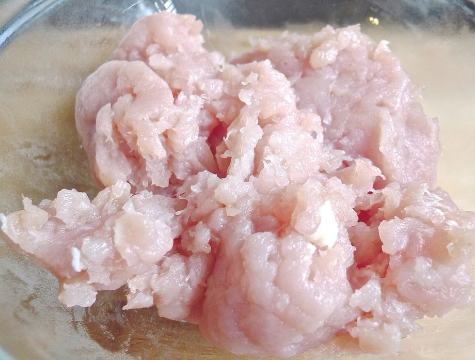 First place ground lean white chicken meat into a large mixing bowl.