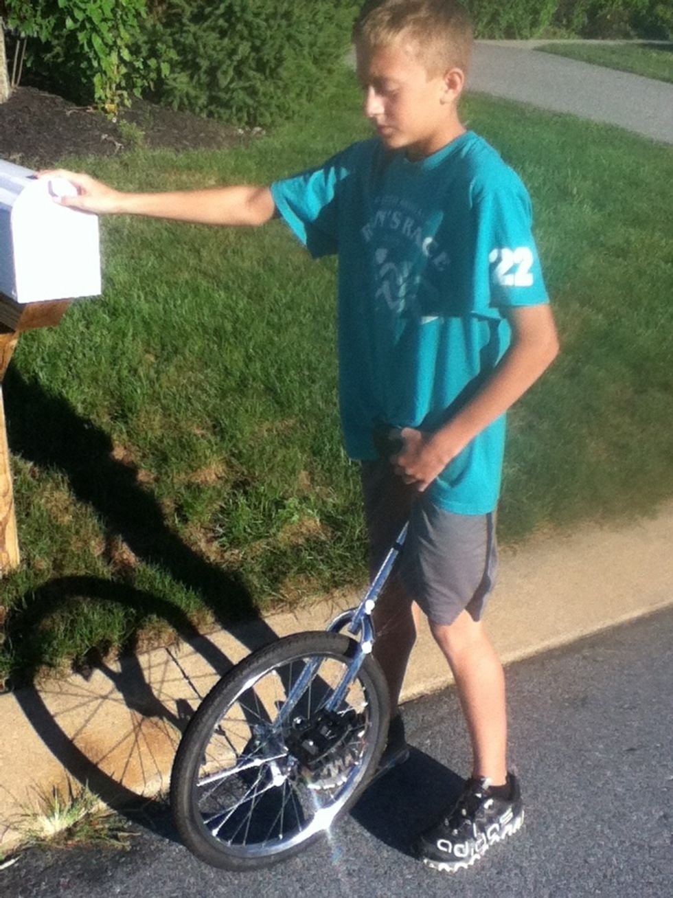 First, place the seat between your legs. Also, hold on to something for balance, preferably a rail. The pedal opposite the rail should be up.