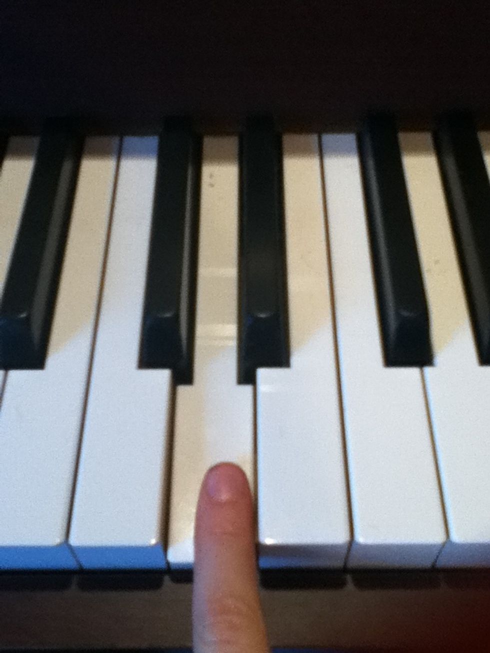 First Play the D note next to middle C