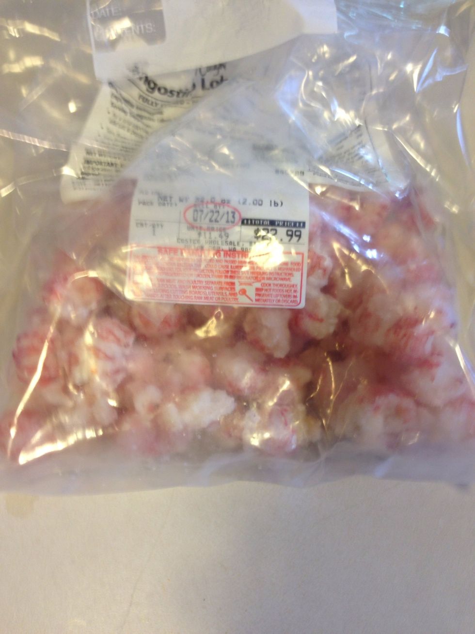 First, preheat steak cooking method of choice, I used my grill. About 375 degrees... Next get your lobster, this is a bag of langistino from Costco, but whatever you have is great! Fresh or frozen.