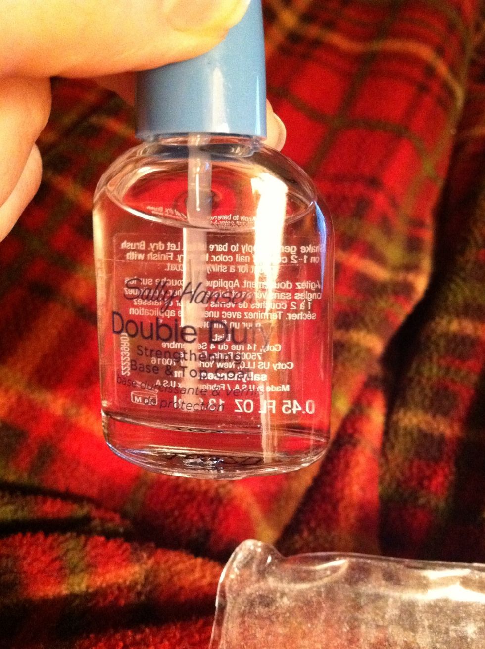 First prep your nails by applying a clear base coat to all nails. I am using Sally Hanson "double duty".
