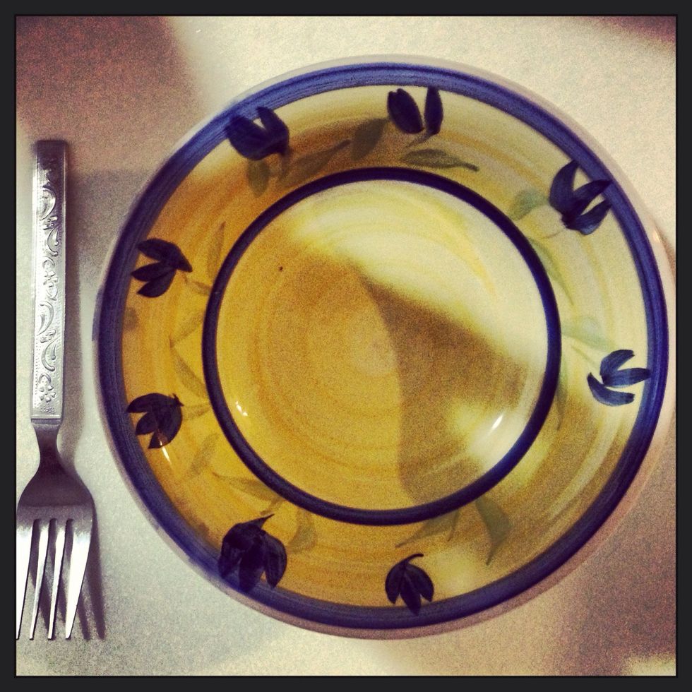 First, prepare an empty bowl and a fork (or spoon) to mix the pudding.