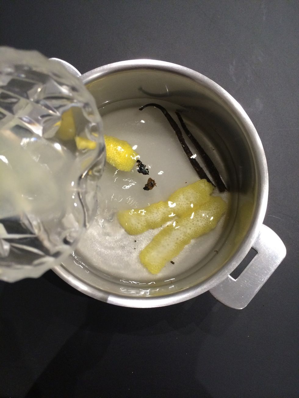 First prepare the syrup for poaching the pears. Put water, sugar, water, lemon rind, lemon juice and vanilla. Boil 5 mins or so lower the heat and let it simmer