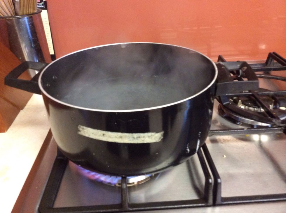First put a saucepan of water on to boil (you will use this later to steam your pudding). Carefully lower the orange into the water, put on the lid and leave it to boil for 10 minutes.