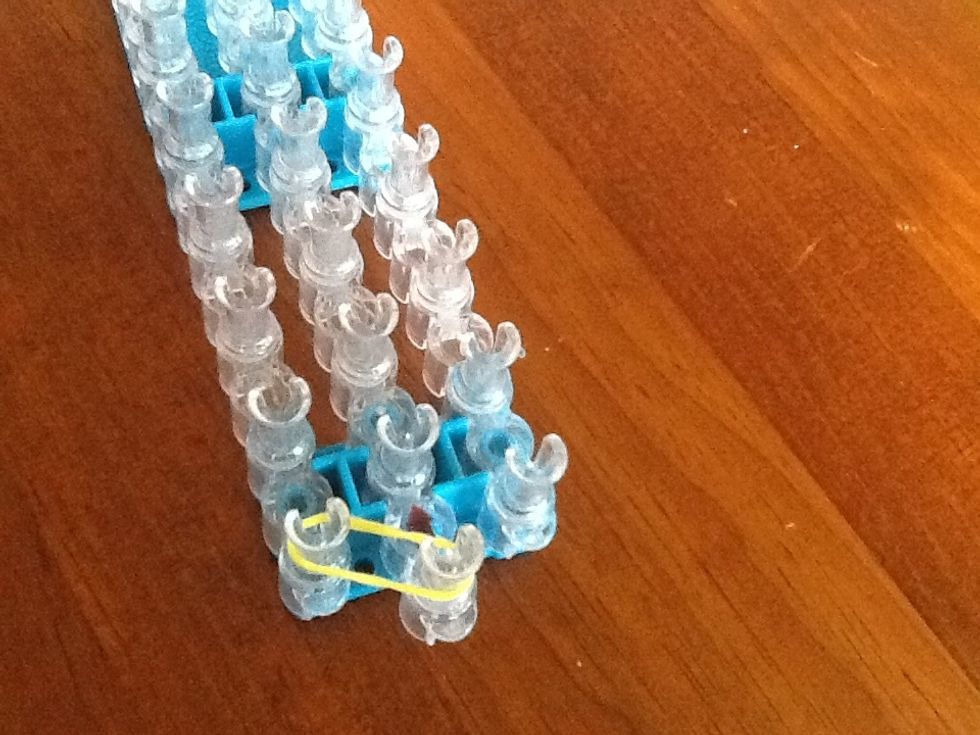 First, put a SINGLE yellow band diagonally at the start.