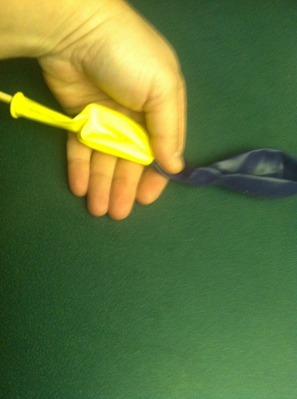 First put one of the 11" round balloons on the chopstick. And gently pull the other 11" round balloon over it