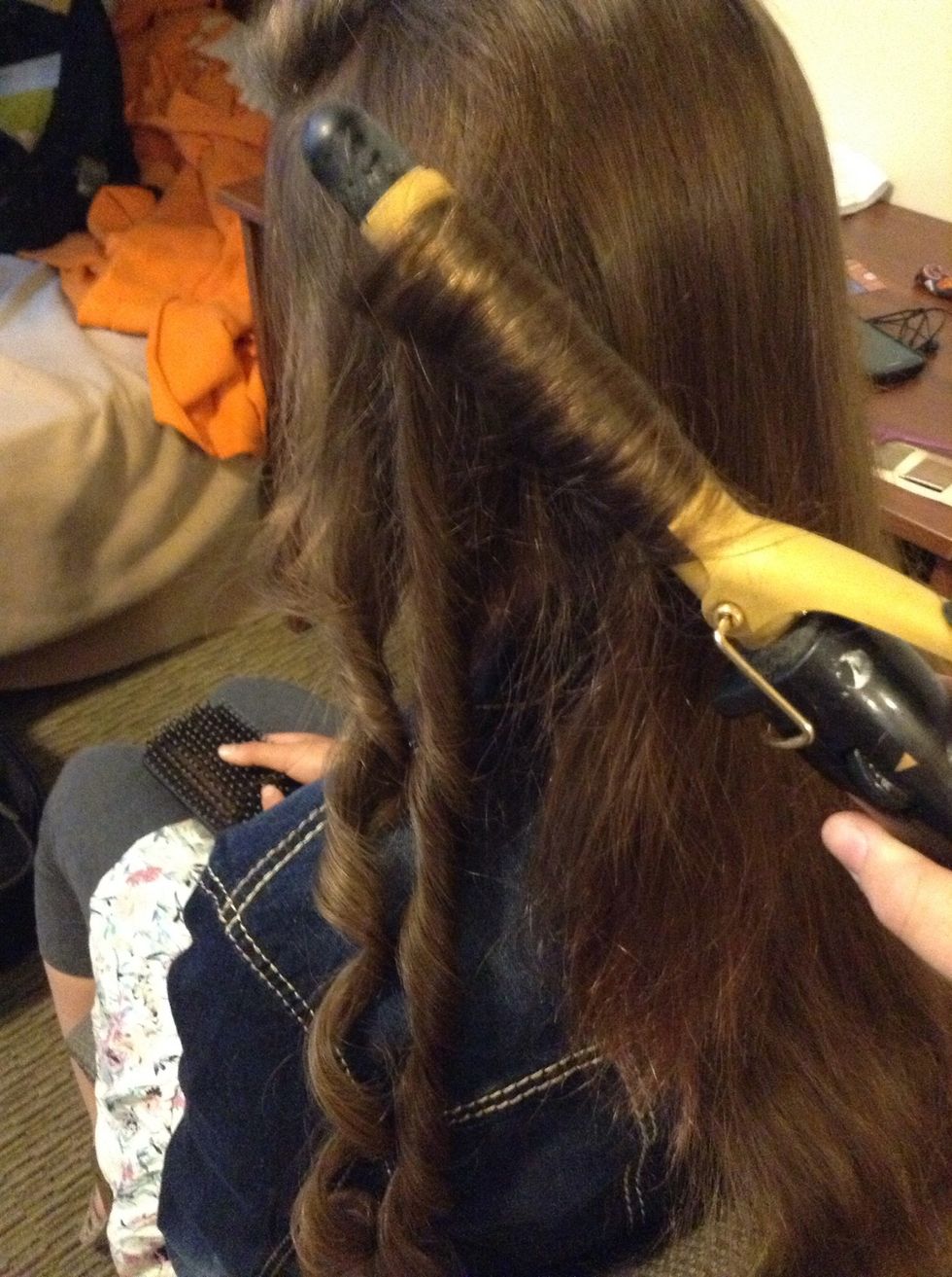 First, put some loose curls in it...