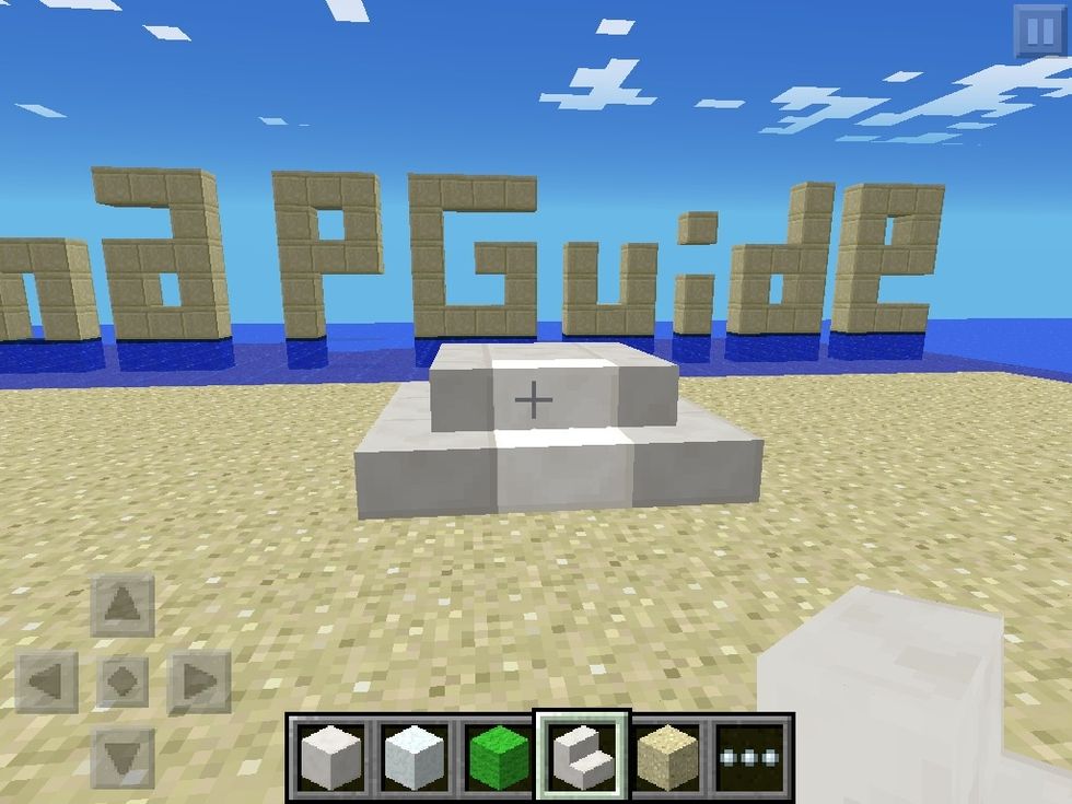 First put the block in the middle. Then put stairs around