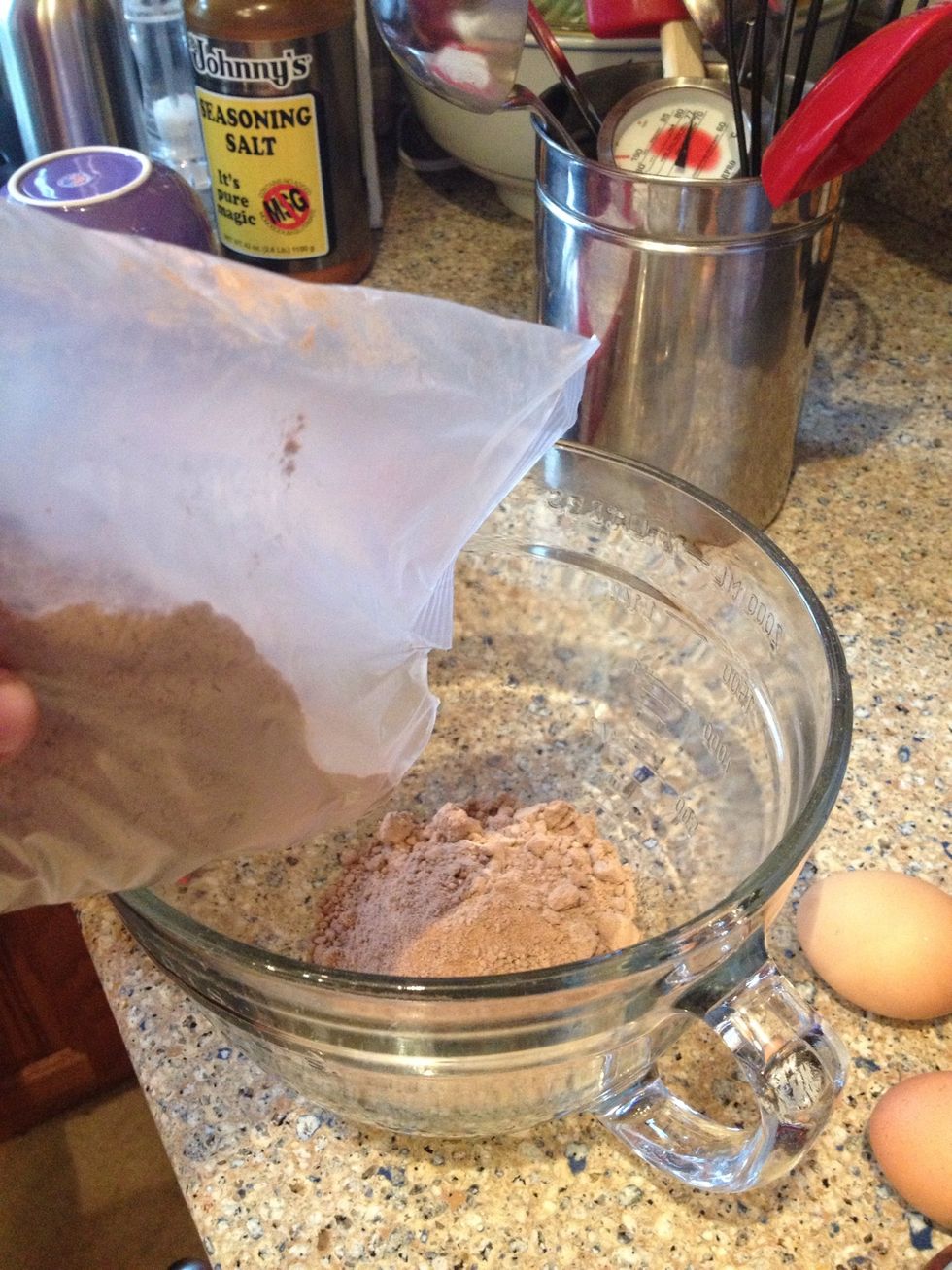 First put the brownie mix into a bowl.