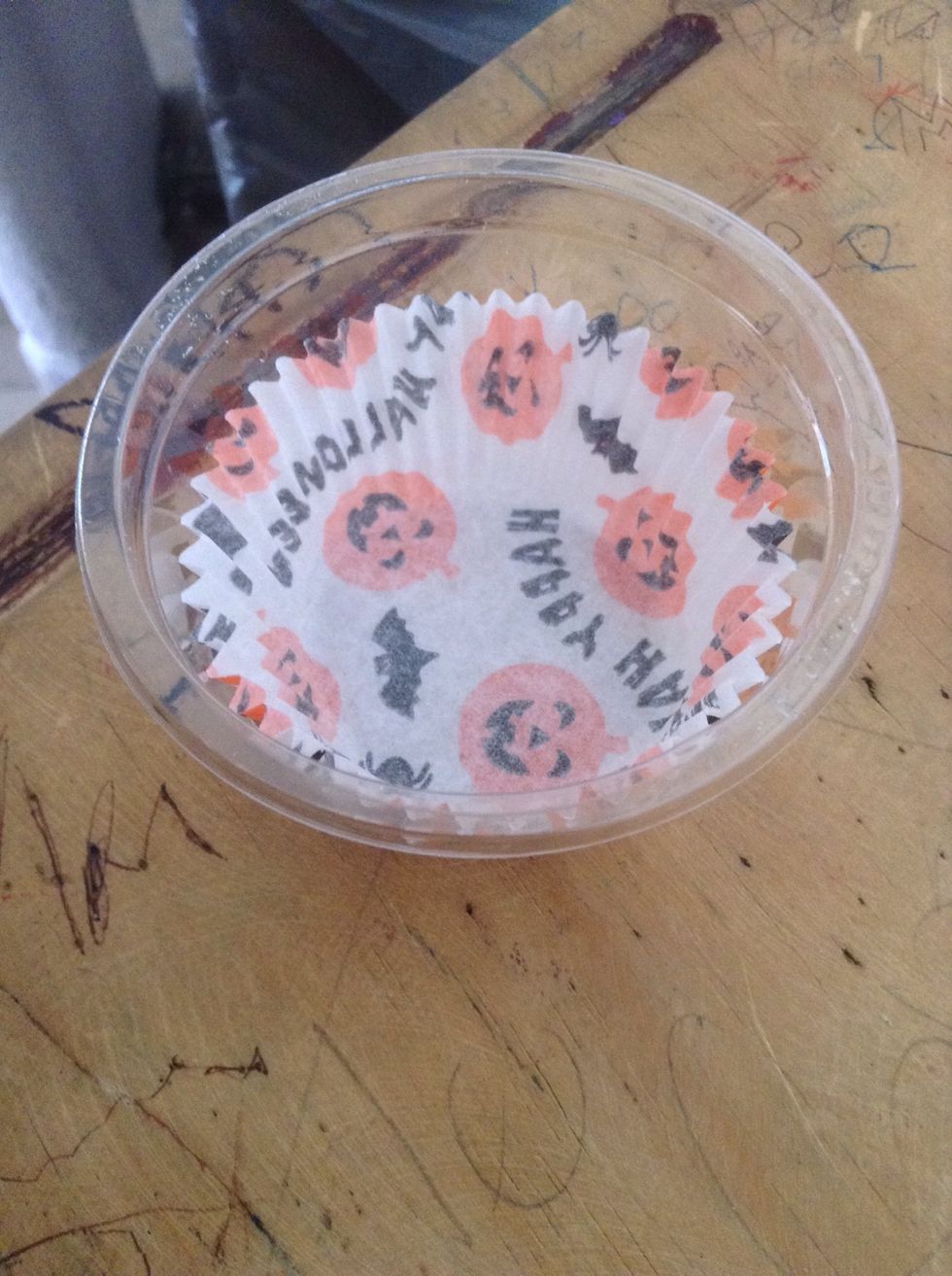 First put the candycup In the container