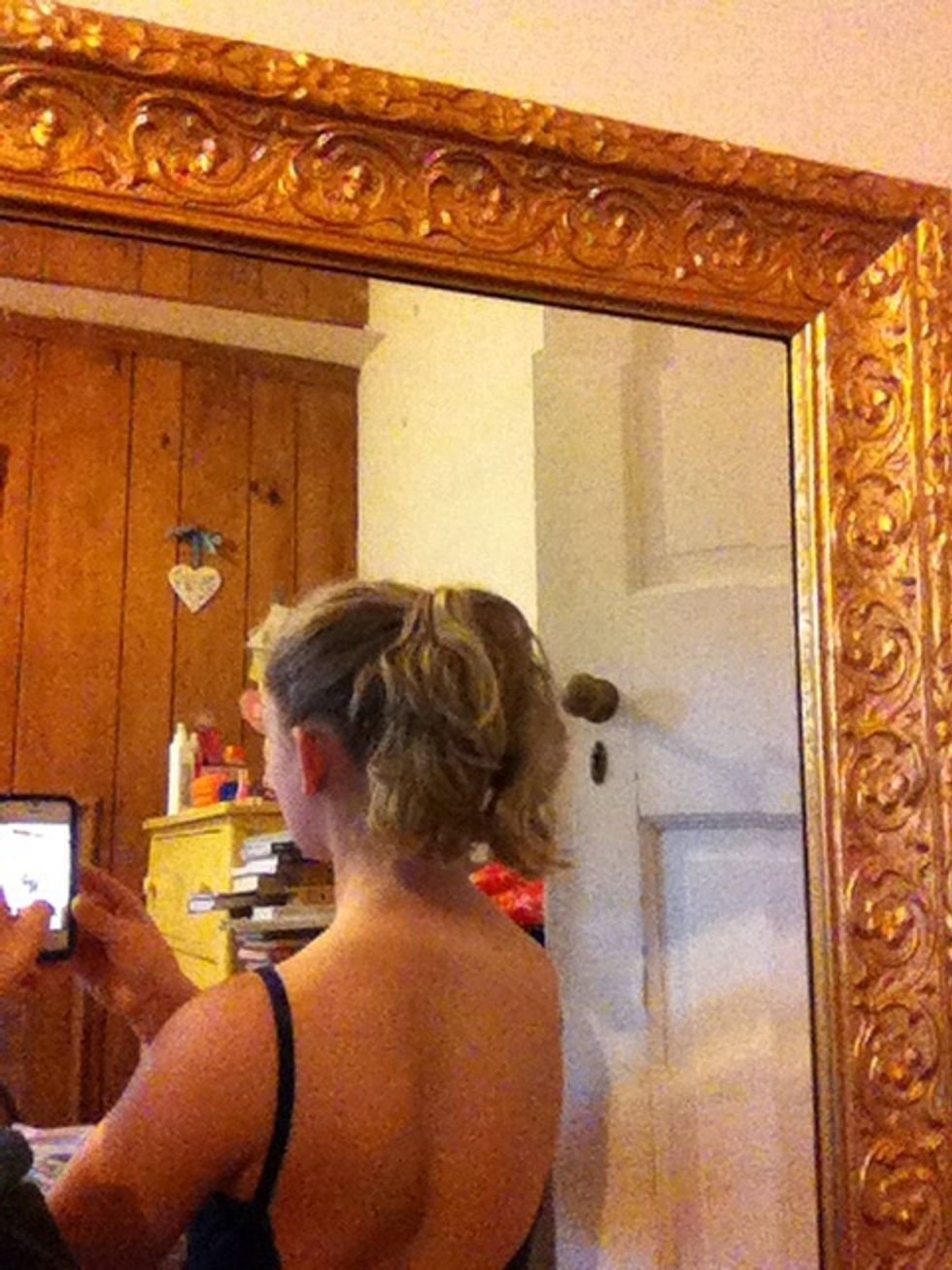 First, put your hair in a high pony tail