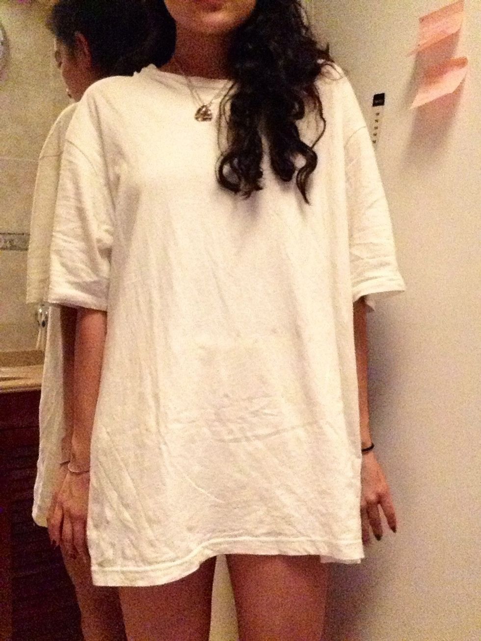 First put your tshirt on, look how it's long enough to be a skirt