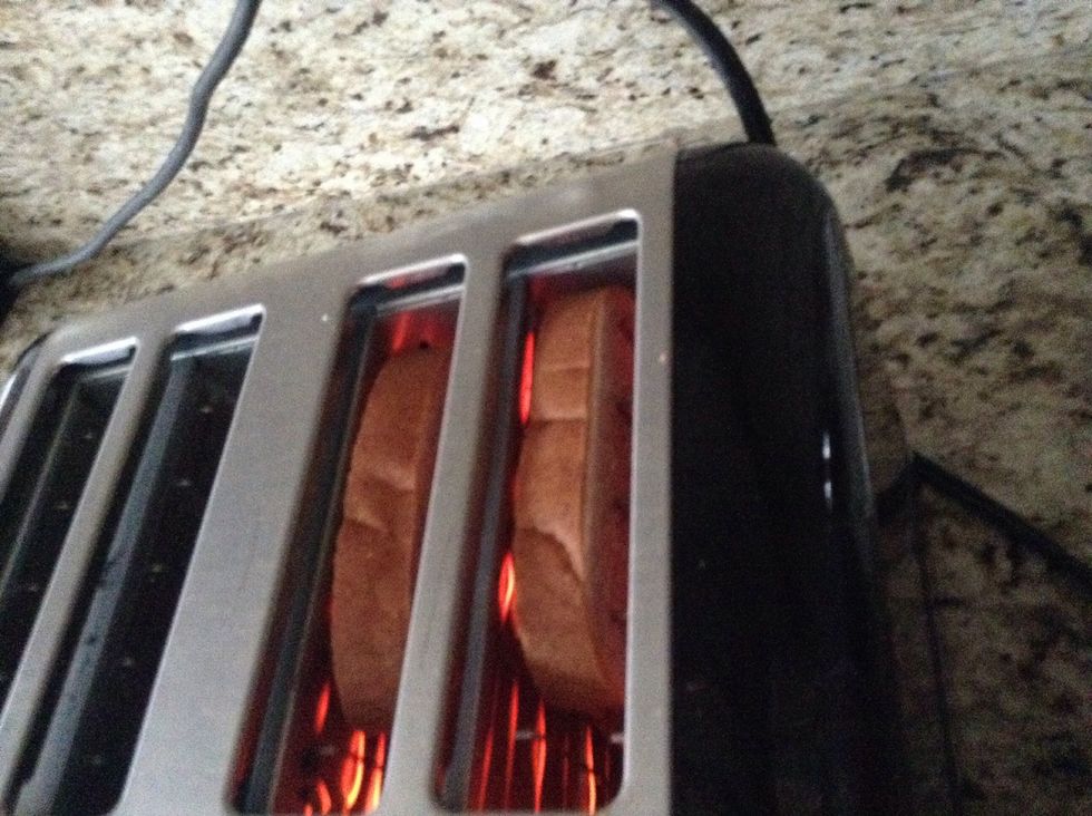 First put your two pieces of bread in the toaster