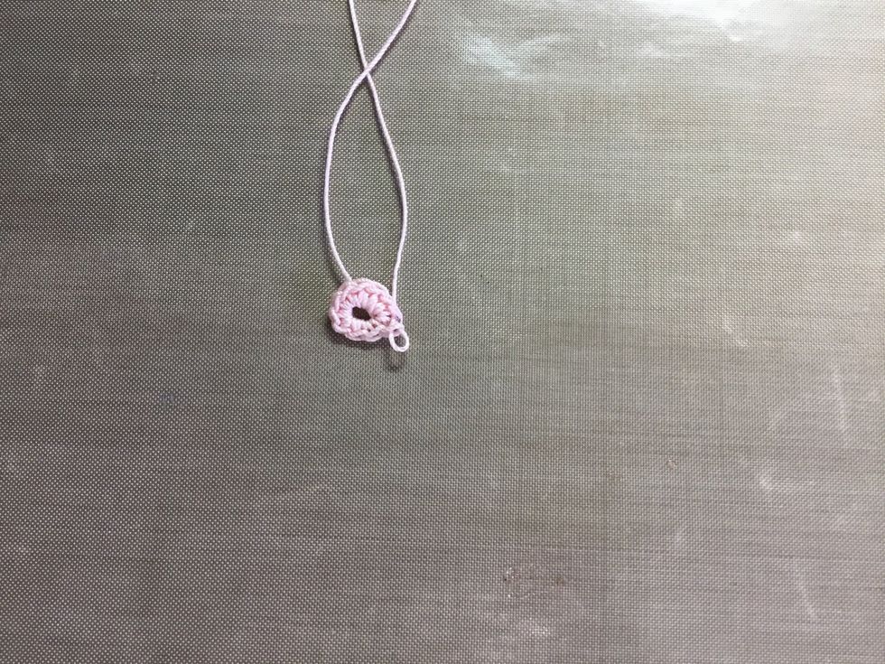 First row pulled up and joined with a slip stitch into the first s.c. (Single crochet).