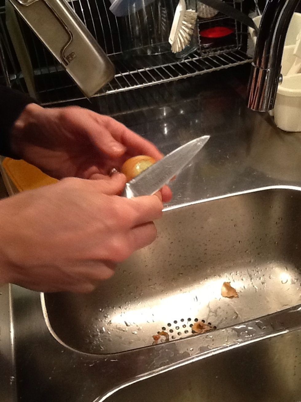 First scale the garlic and onion.