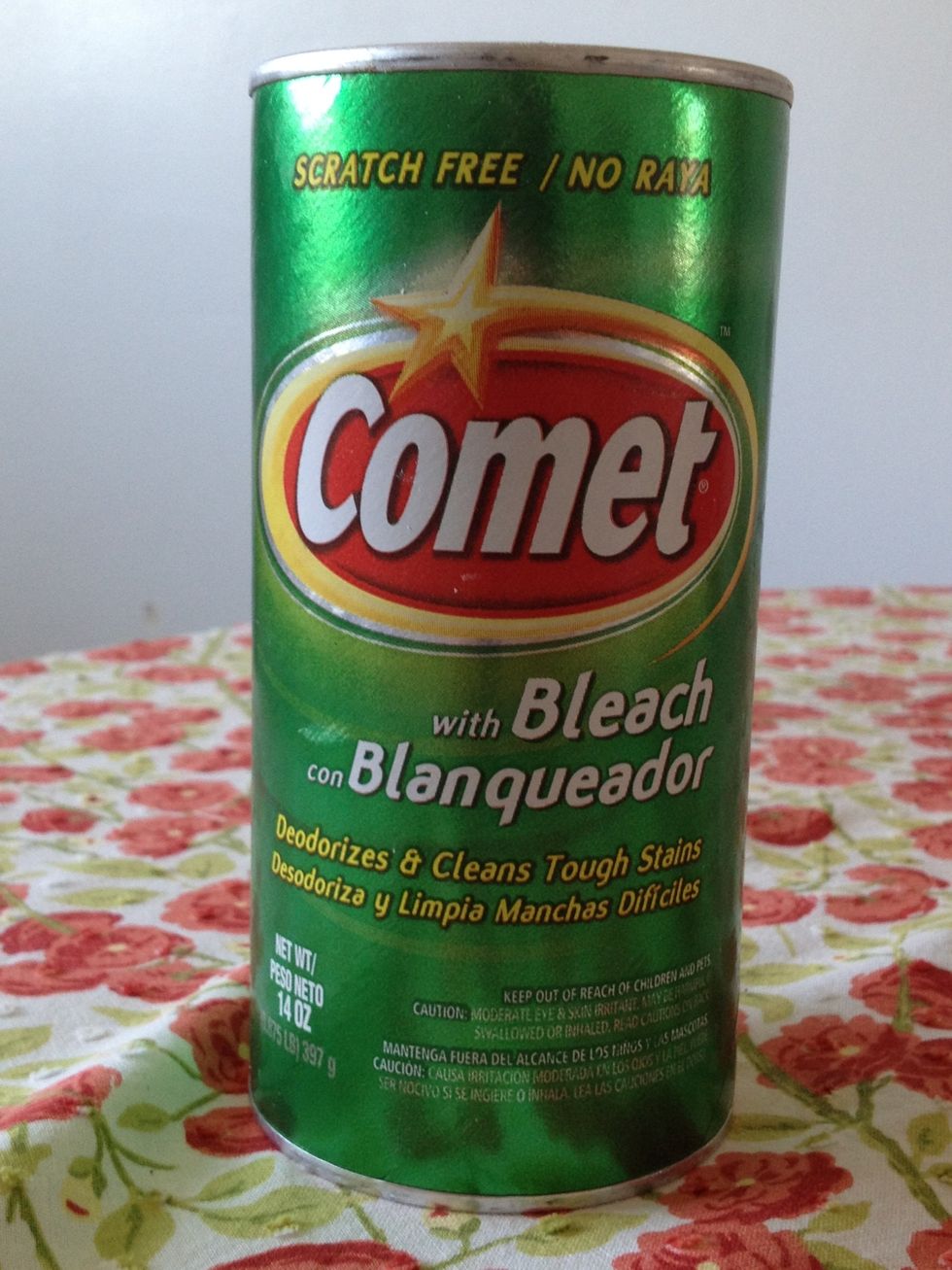 First she generously sprinkled Comet cleanser onto the pan.