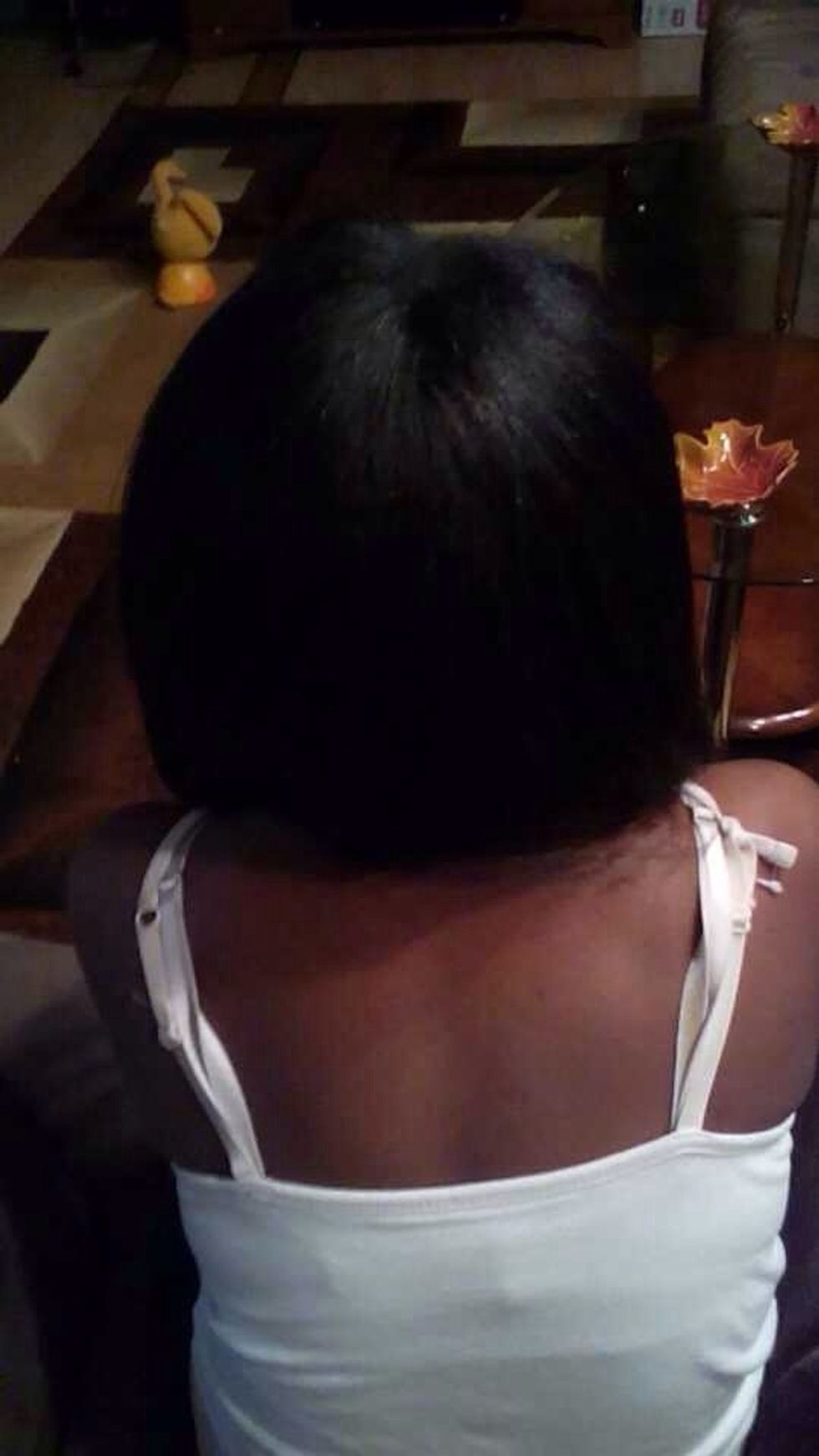 First, spread out your hair and brush it. Next section your hair using the comb.