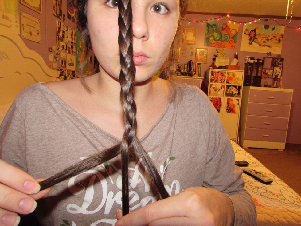 First start by braiding all the way down the length of your hair into a three strand braid. Don't make it super tight or extremely loose, keep the tension just right.