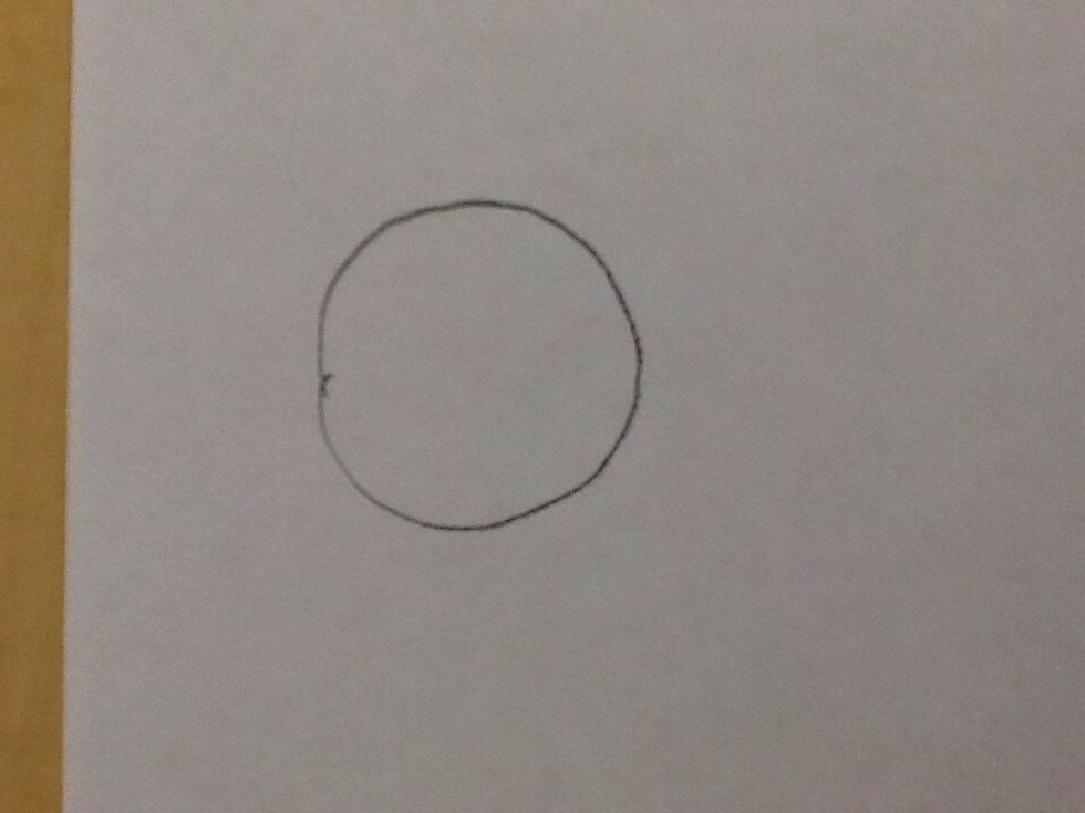 First, start by drawing a circle.