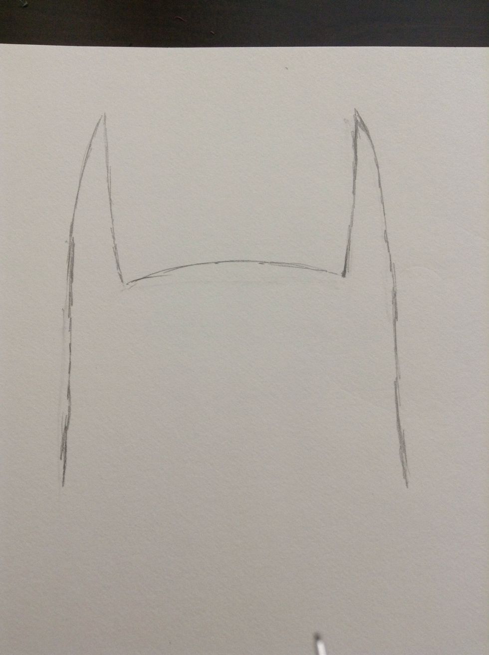 First start of with his pointy ears. There are many different ways to draw his ears but I chose the long pointy ones.