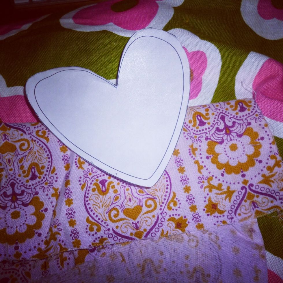 First start out with a pattern. I printed out this heart for my sachets. I've used cookie cutters for patterns as well. For this project I'm repurposing aprons I found at the thrift store.