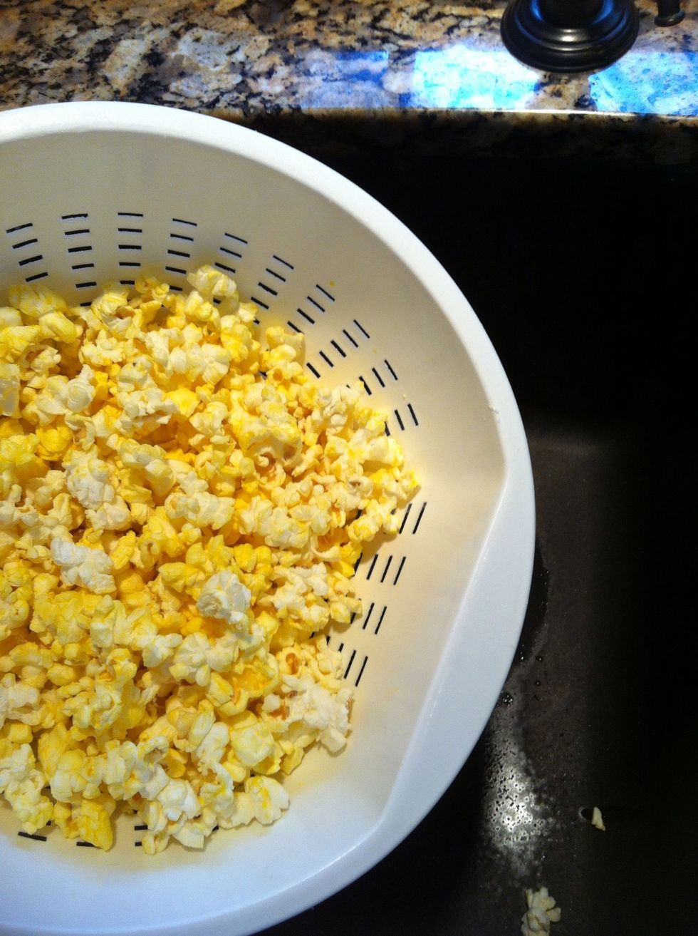 First start with 4 microwave bags of buttered popped corn. I salt mine as soon as its out of the microwave. Shake it good before you place in large bowl. Try to get all the unpopped kernels discarded