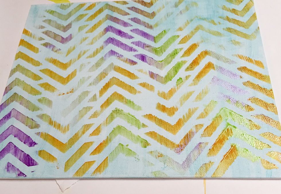 first stenciled layer of canvas; let dry before proceeding.