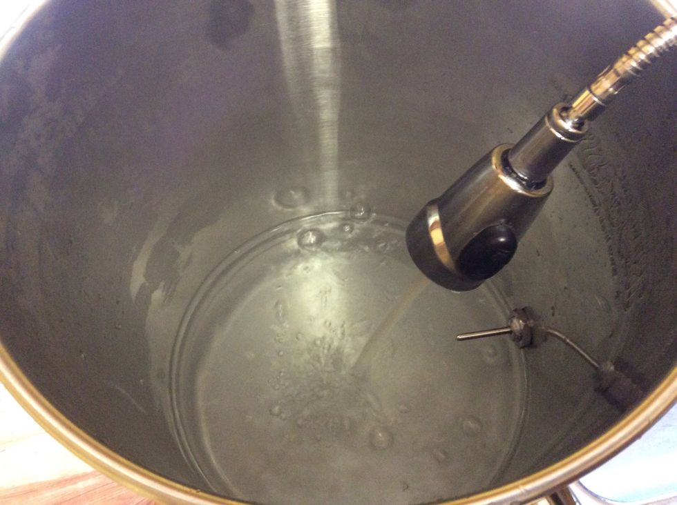 First step is cleaning. Sanitation is the most important thing with beer brewing. Fill up your kettle.