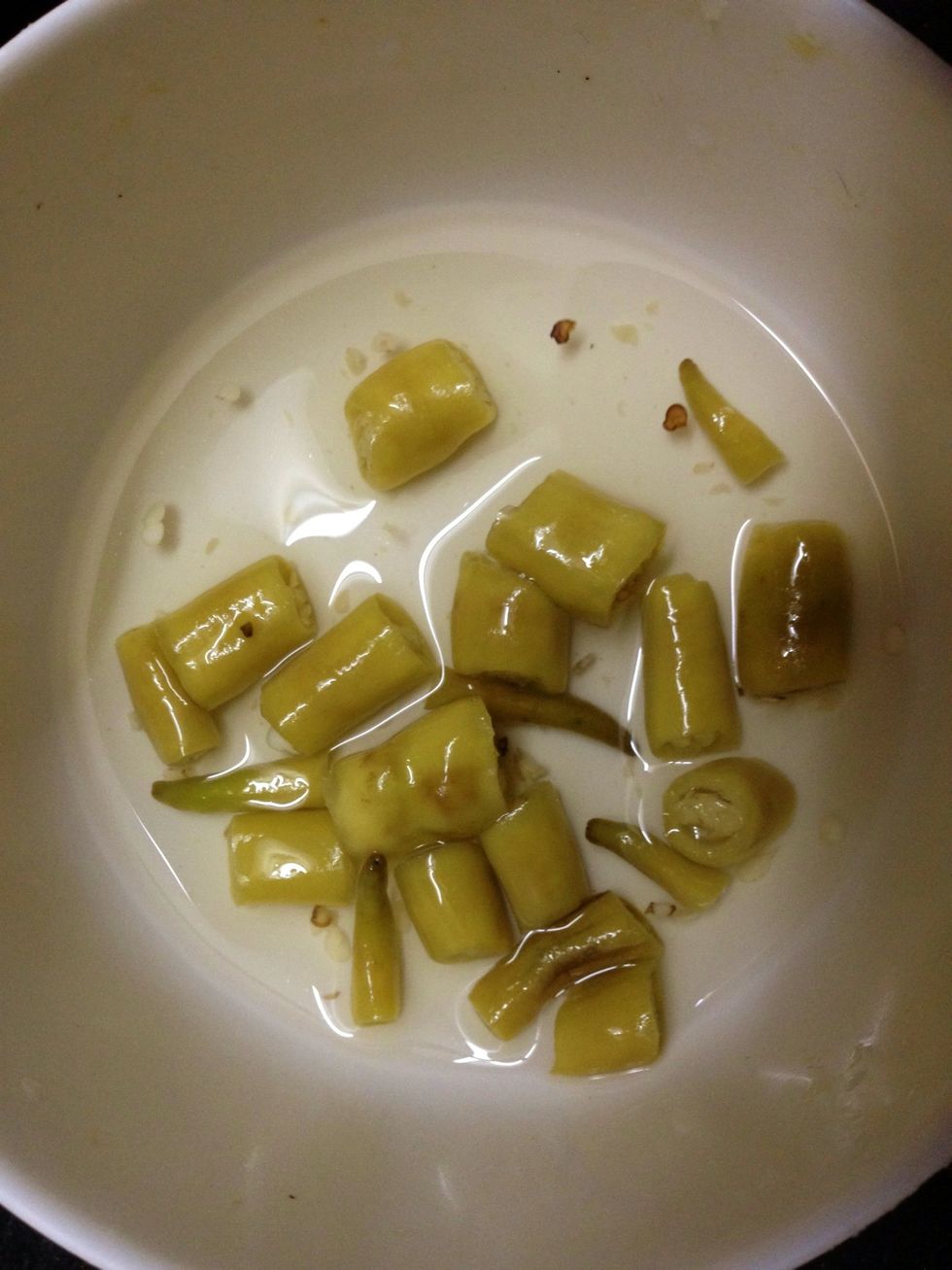 First step is to soak the green chilies in vinegar. Leave it as long as possible. But if short of time 1 hour should be ok. More chillies can be added if u like .