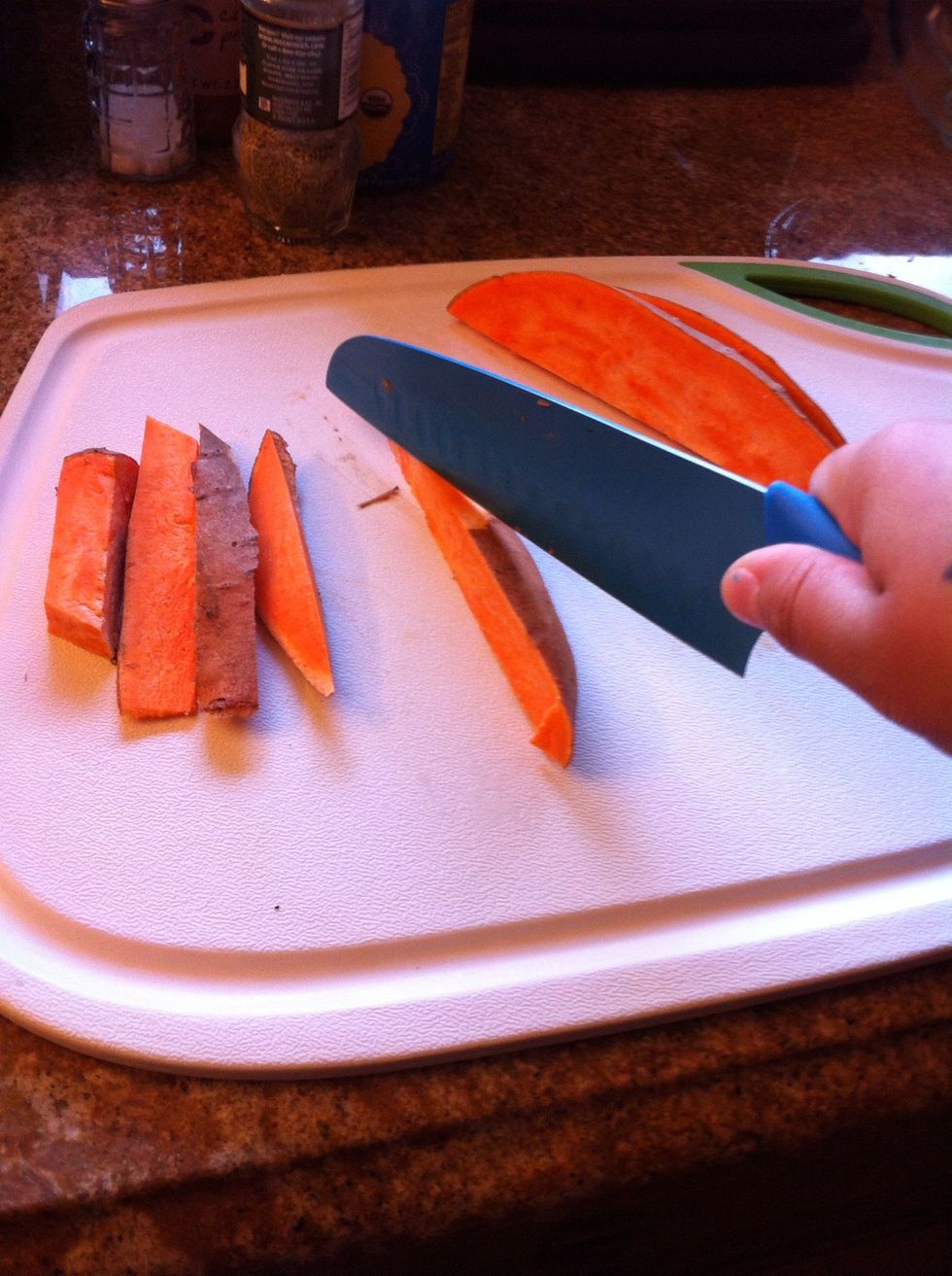 First step would be to cut the sweet potato into wedges. If you like thinner fries just cut how you like. Make sure they are the same size so they cook evenly.