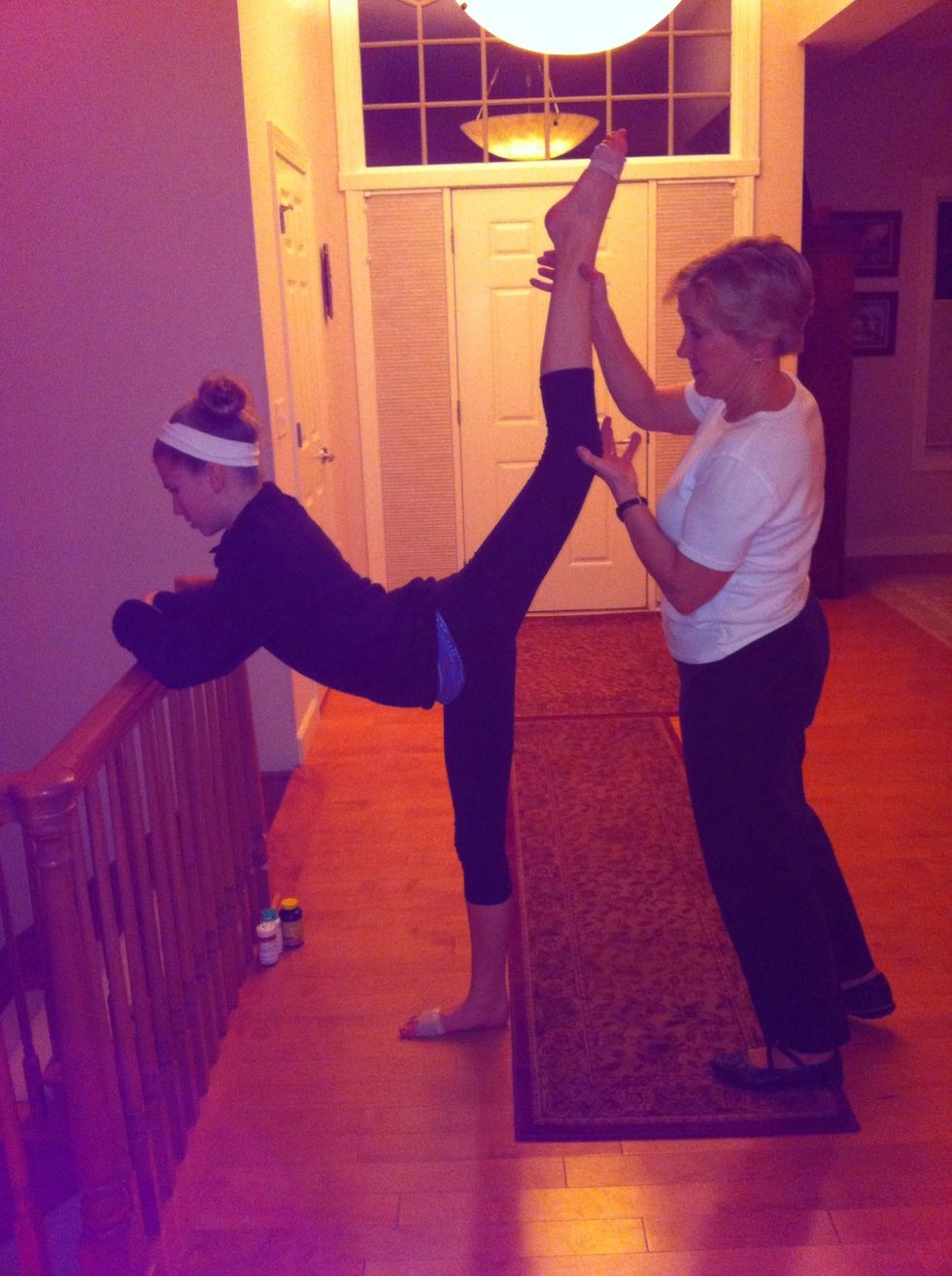 First stretch: You will need something to hold onto (I used the stair railing) and my mom to help. Have your partner lift up your leg as far as it can go and hold it for 15 sec. Repeat 3-5 times.