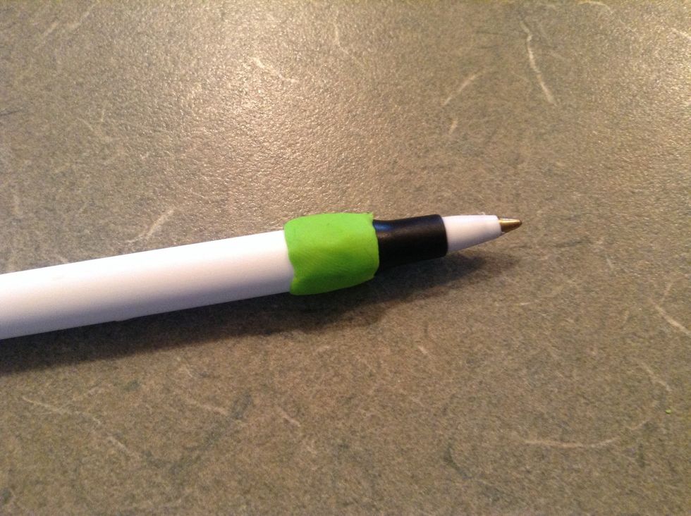 First, take a piece about one inch long and wrap it around your pen
