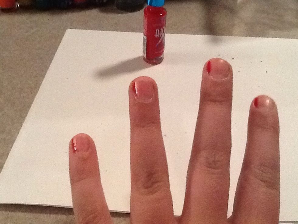 First take the red and make a thin line the nail polish should be the Art Deco which is a thin brush.