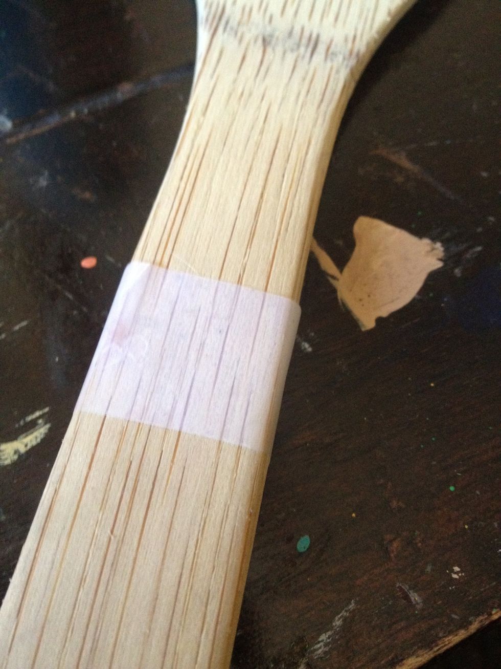 First, tape off the desired length of the painted area. You'll want to make sure this line of tape matches up all the way around! Now, take some light sandpaper and briefly scratch up the surface.