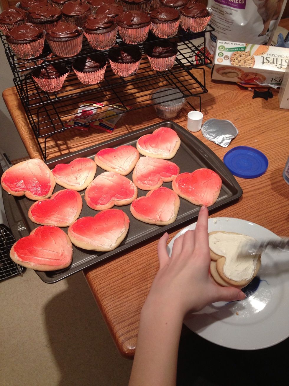First the cookies need the frosting spread on...