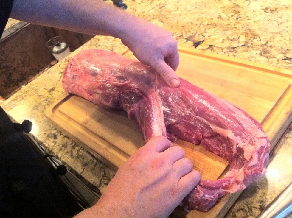 First, there are two muscles that make up the tenderloin. Locate the vein of fat that separates the two and gently pull them apart at the narrow end of the loin until they begin to separate.