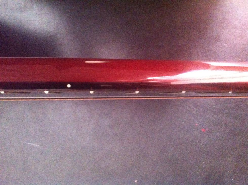 First thing you do is find the dot on the guitar...It should be on the fith "opening"(thread).