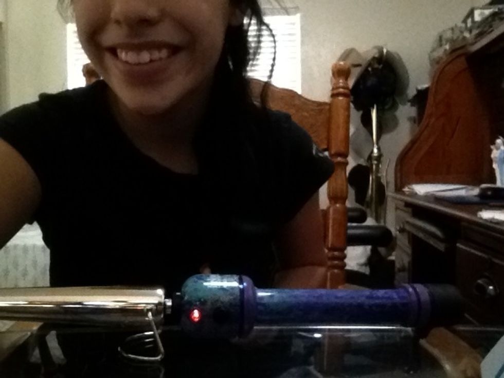 First turn on wand and part your hair c;